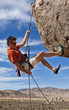 Rock climber rappelling.