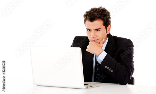 Photo: Business man with a laptop Business man with a laptop