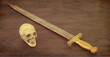 Antique sword and skull with brown texture