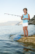 Fishing -  girl fishing at the beach