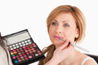 Pretty woman having her make up done by a make up artist