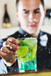 pro barman prepare coctail drink on party