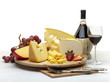 Cheese still life on a wooden round tray