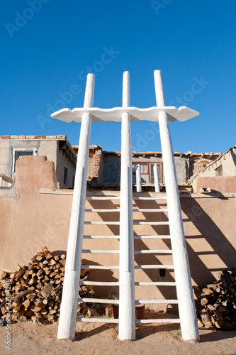 Photo: Traditional white ladders in Acoma Pueblo, NM Traditional white ladders in Acoma Pueblo, NM