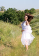 beautiful girl in white dress in a meadow