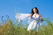 beautiful girl in white dress in a meadow