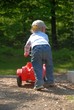 Child with bobby car