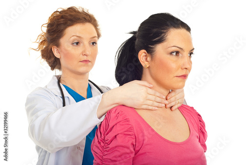 Photo: Endocrinologist examine thyroid woman Endocrinologist examine thyroid woman