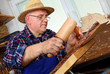 Photo: Woodcarver work in his workshop Woodcarver work in his workshop