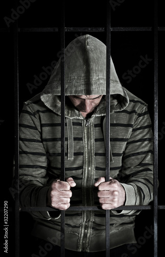 Photo: man in prison cell man in prison cell