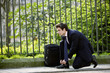 A businessman tying his shoelaces
