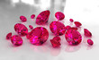 Set of round red ruby stones on glossy surface Set of round red ruby stones on glossy surface