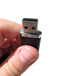 fingers holding usb flash stick