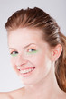 Smiling woman with braces on teeth