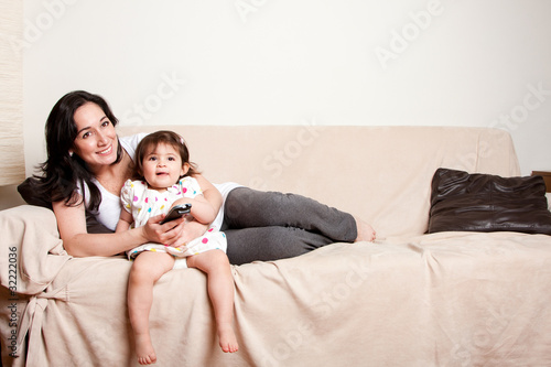 Photo: Mother and daughter watching TV Mother and daughter watching TV