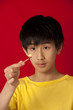 ����: Asian boy observing flame of burning match � Ann Stephenson #32223212