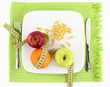 Fruits and vitamins with measuring tape on a plate Fruits and vitamins with measuring tape on a plate