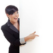 Smiling young business woman behind a clear blackboard