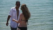 HD720p50 Happy young couple relaxing on the beach.