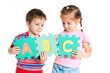 boy and girl holding letters