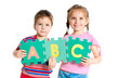 boy and girl holding letters