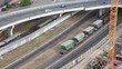 railroad cargo train and cars moving on bridge in city railroad cargo train and cars moving on bridge in city