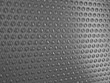 Carbon fibre surface with round shapes