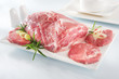Raw chuck steak with tableware on white background