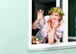 Portrait Happy Ukrainian woman in the window