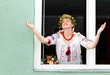 Portrait Happy Ukrainian woman in the window