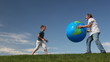 Video: senior with grandson throw inflatable Earth against sky senior with grandson throw inflatable Earth against sky