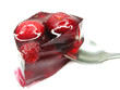 red colored jelly marmalade with spoon inside red colored jelly marmalade with spoon inside