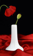 White vase with bud poppy flower