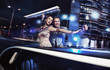 Smiling couple over night city background
