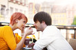 Cute young couple eating lunch