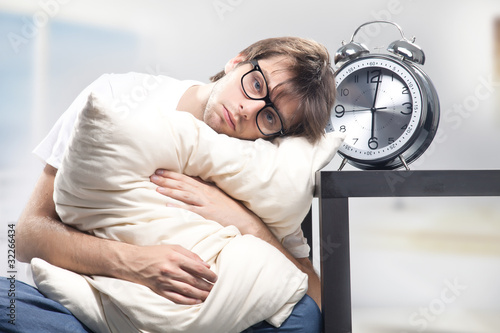 Photo: Sad man holding pillow Sad man holding pillow