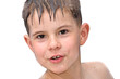 A boy swims in the bathtub