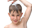 A boy swims in the bathtub