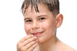 A boy swims in the bathtub
