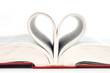 Close up heart of book pages isolated on white background.