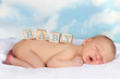 Wooden blocks on newborn baby