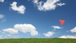 boy runs with red kite on hill against blue sky with white cloud