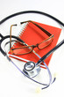stethoscope with glass on red note book