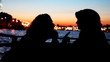 silhouettes girls sitting and talking on deck of ship sailing