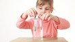 girl mixing water in the glass using spoon both side