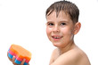 A boy swims in the bathtub