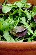 fresh salad mix in wooden bowl