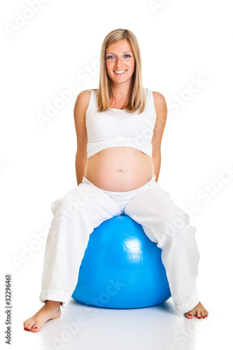 Photo: Pregnant woman excercises with gymnastic ball Pregnant woman excercises with gymnastic ball