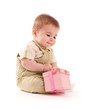 Photo: Portrait of happy baby boy with small pink gift box Portrait of happy baby boy with small pink gift box
