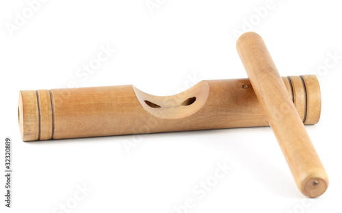 Photo: Wooden claves isolated on a white background. Wooden claves isolated on a white background.